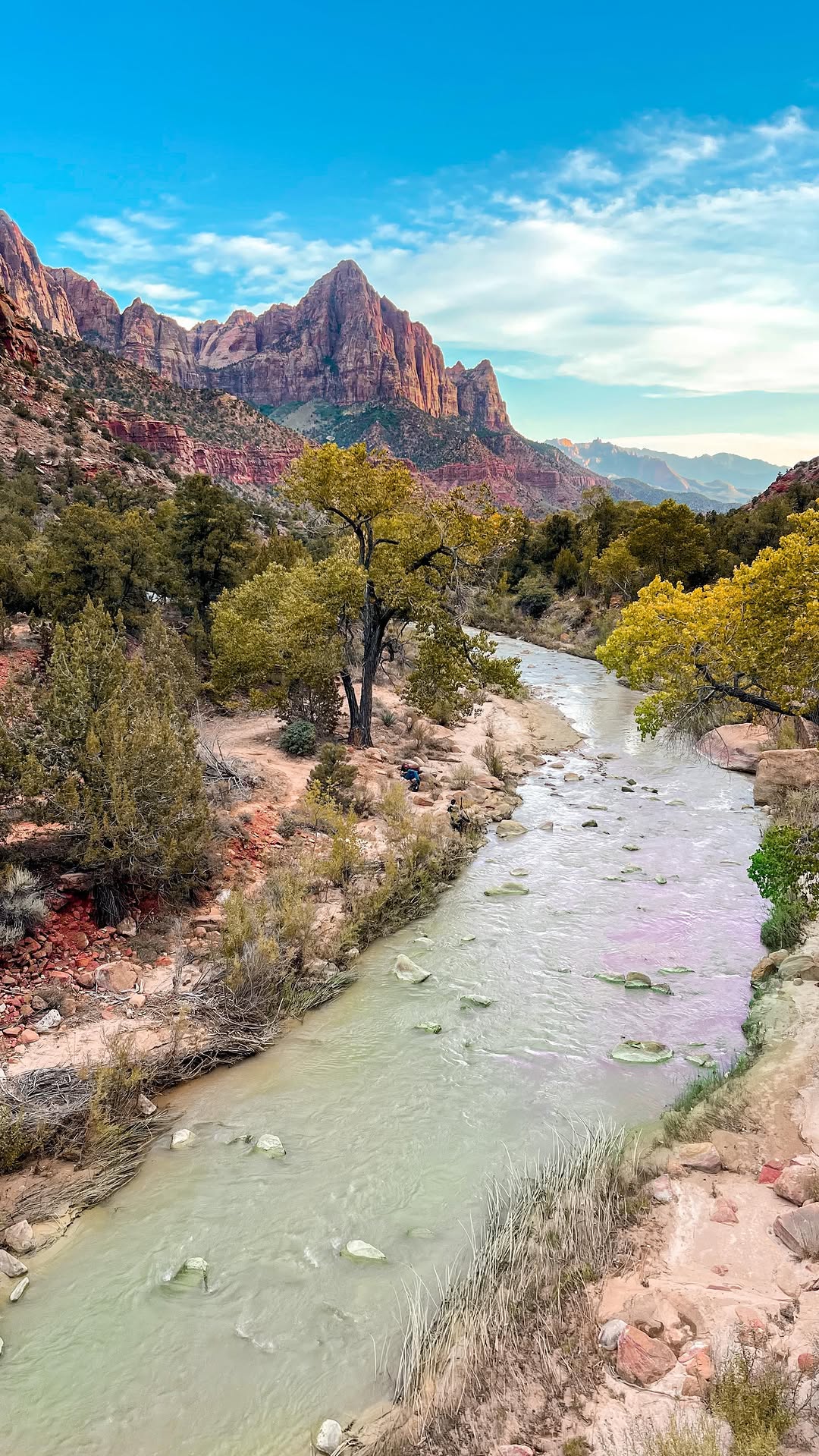 The sunlit Watchman mountain peak seen from Canyon Junction Bridge