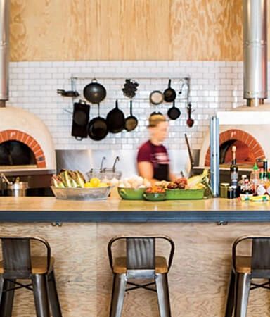 Industrial Eats and their wooden ovens where all the magic happens. By Discover Buellton.
