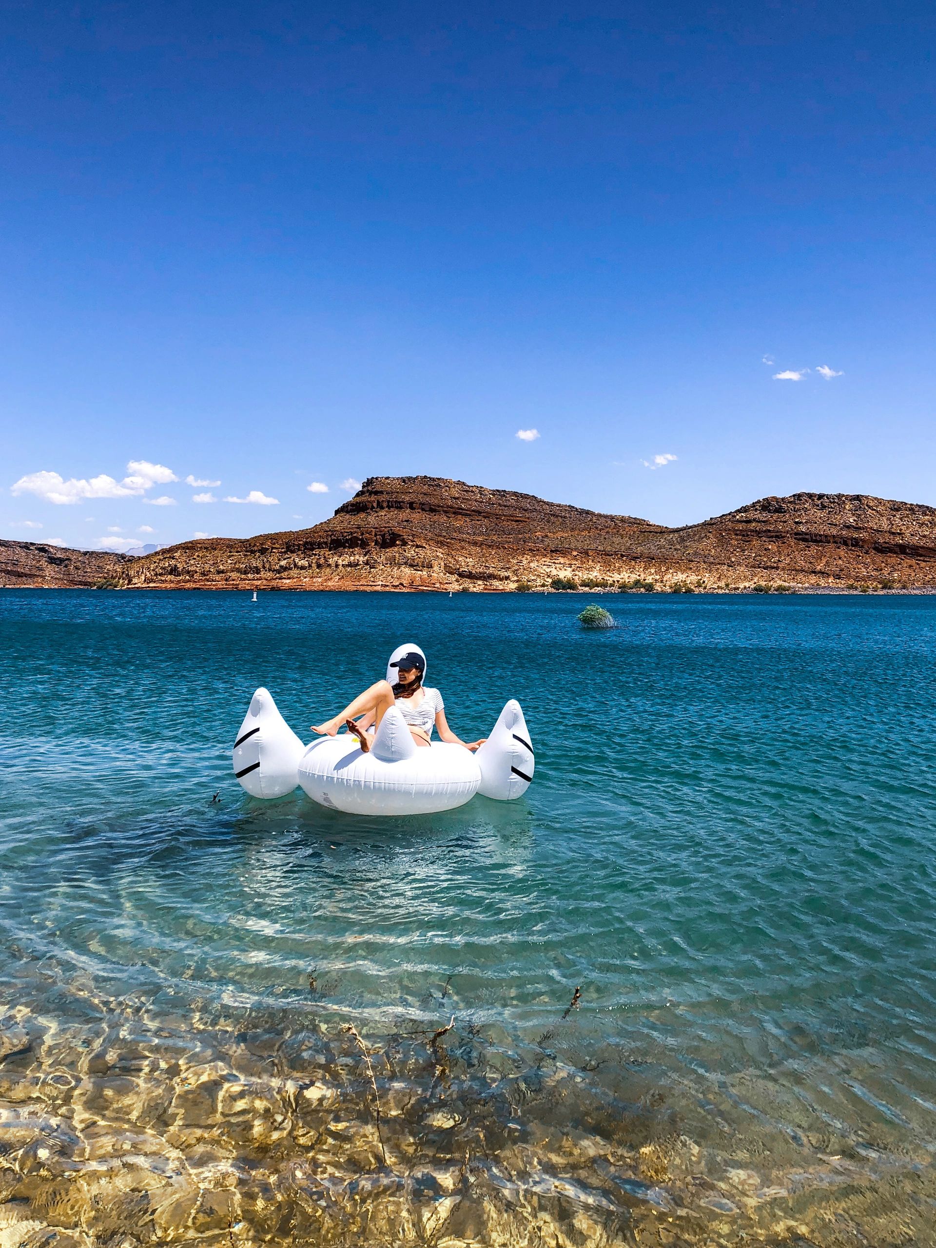 A girl is on a floatie at Quail Lake