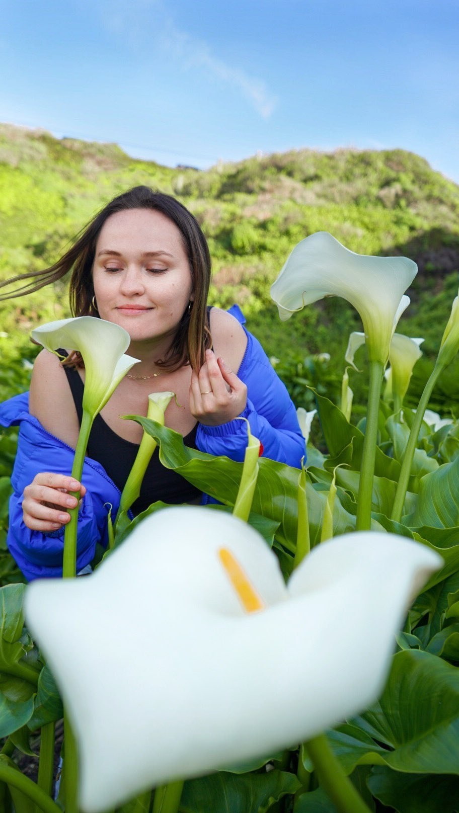 Polina among white calla lilies in Calla Lily Valley, Big Sur