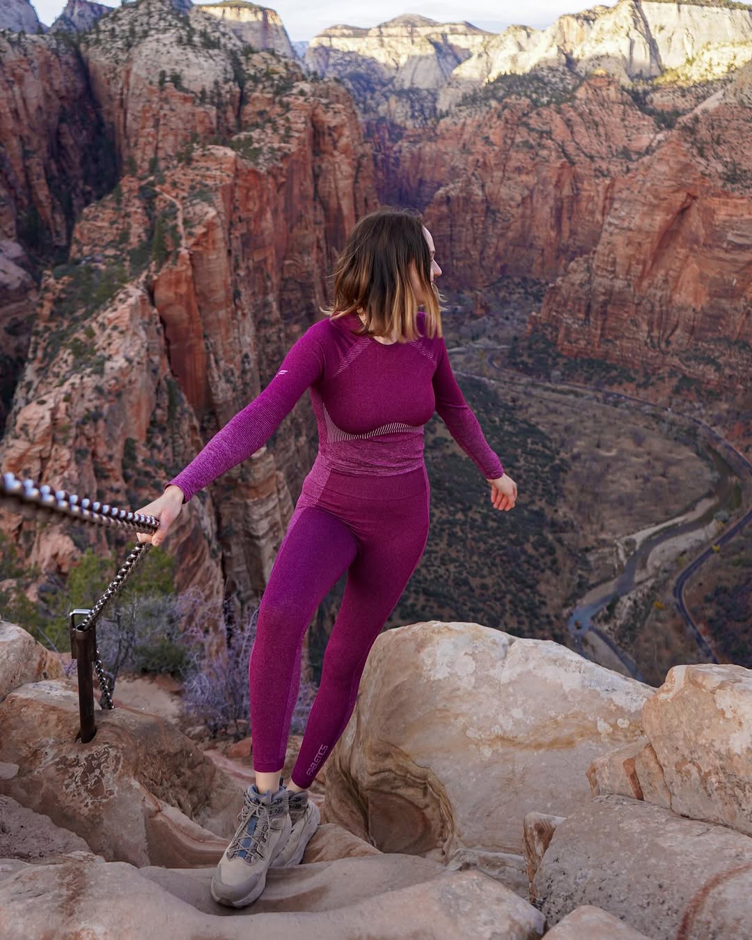 The summit view at Angels Landing, with canyon cliffs stretching below