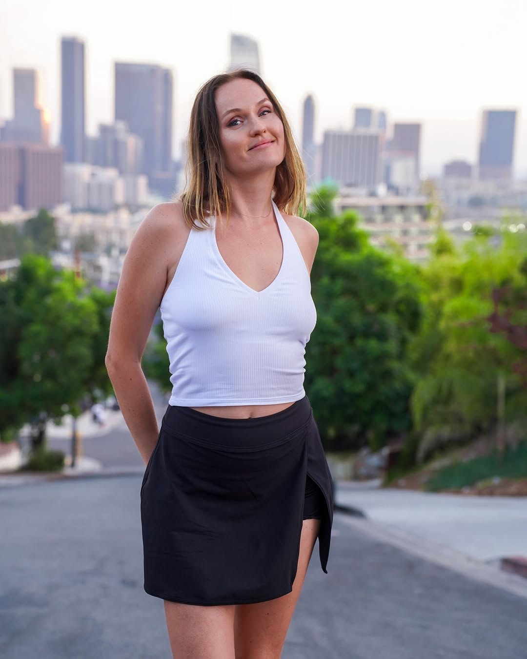 Polina with the Downtown Los Angeles skyline behind her on White Knoll Drive