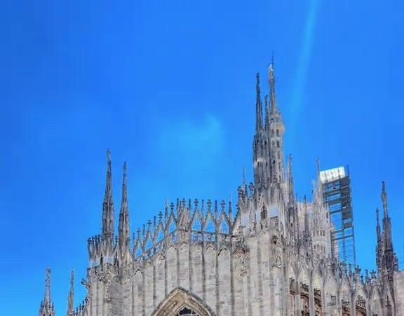 The Gothic side of the Duomo di Milano seen from a terrace across the street