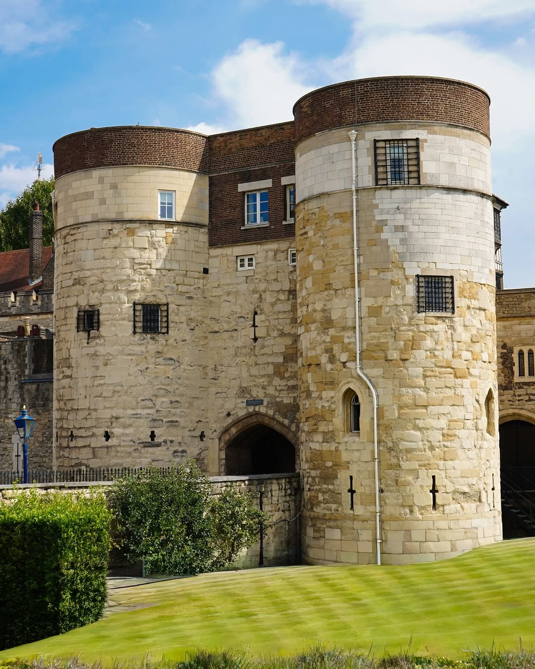 A round stone tower and gatehouse at the Tower of London