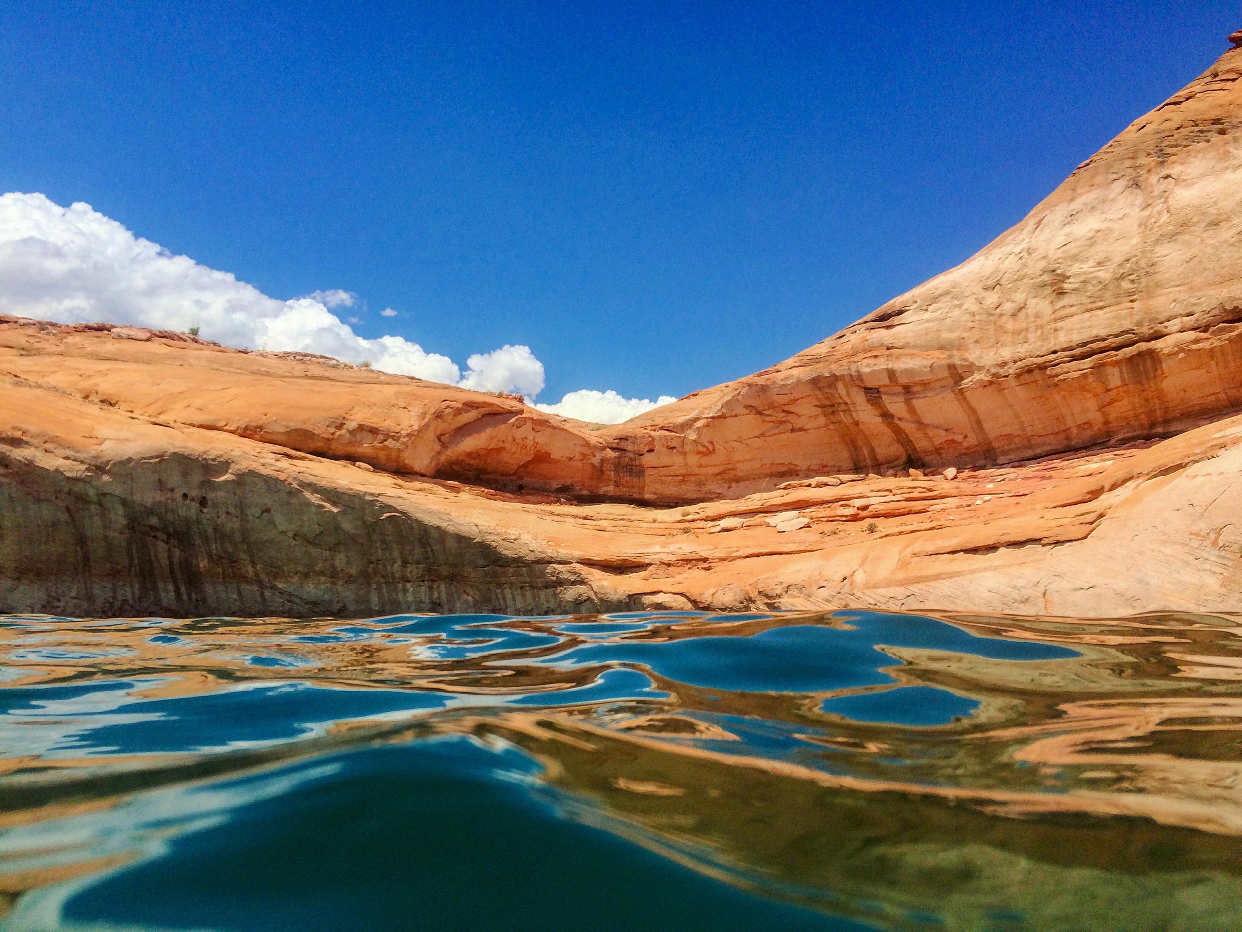Blue sky and red rocks contrast at Sand Hallow Reservoir