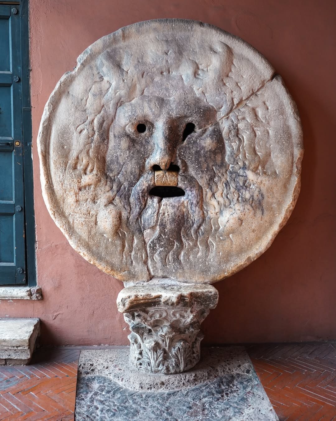 The Bocca della Verità, a round marble mask, in the portico of Santa Maria in Cosmedin